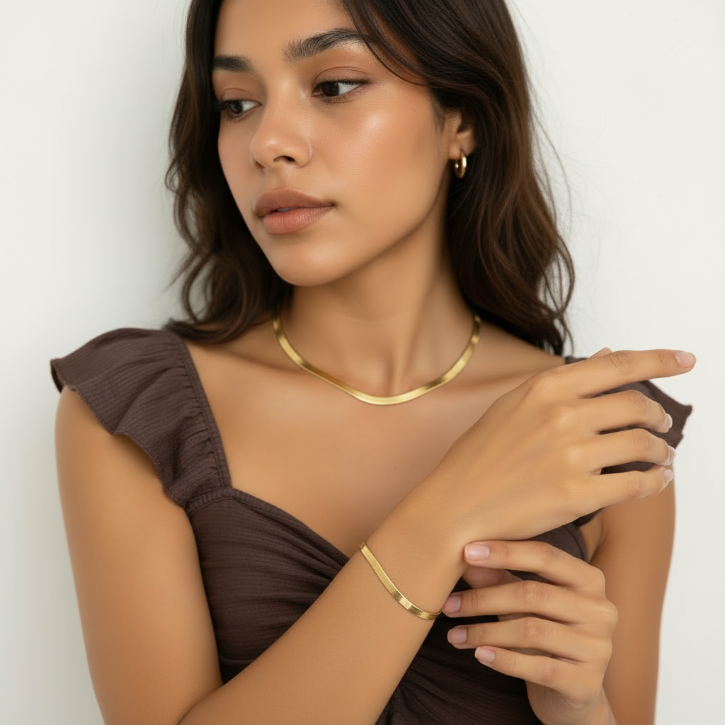 Woman wearing matching gold snake chain necklace and bracelet set – anti-tarnish everyday jewellery