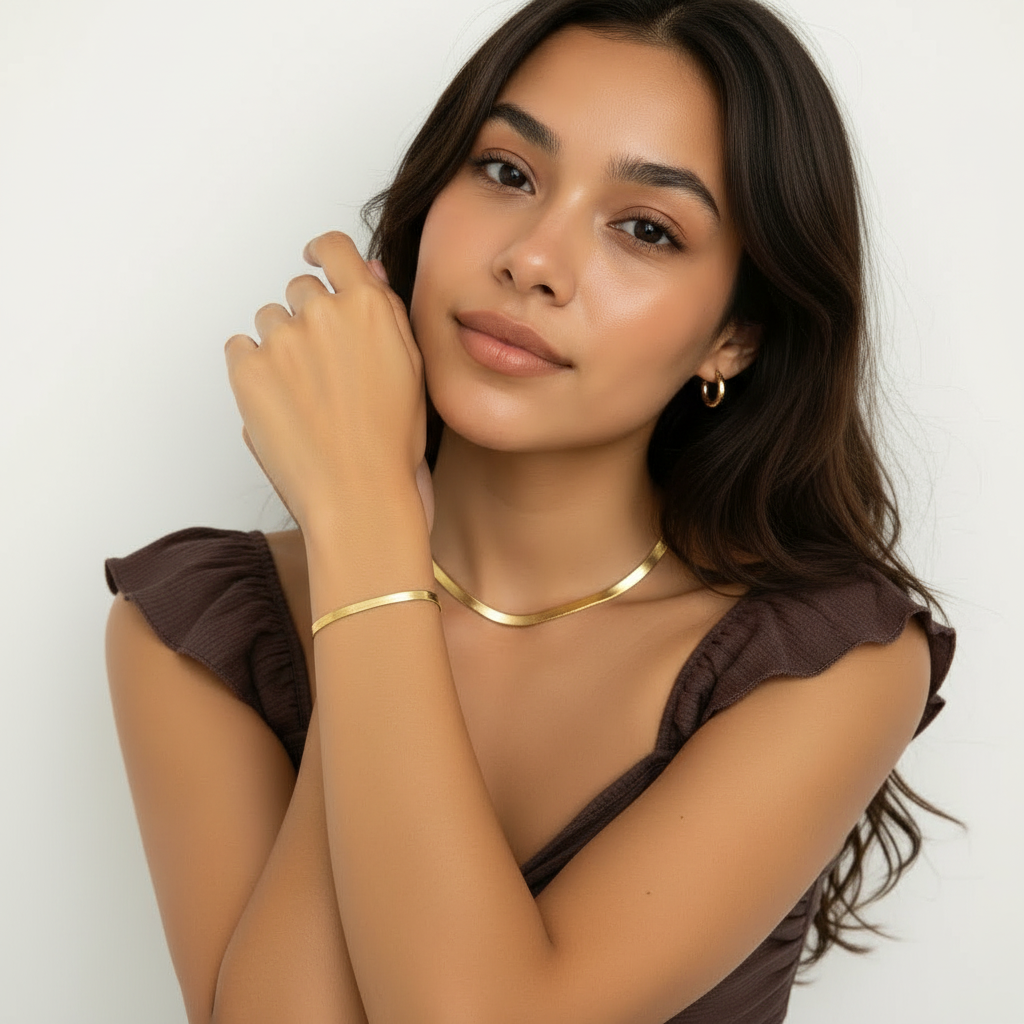 Woman wearing matching gold snake chain necklace and bracelet set – anti-tarnish everyday jewellery