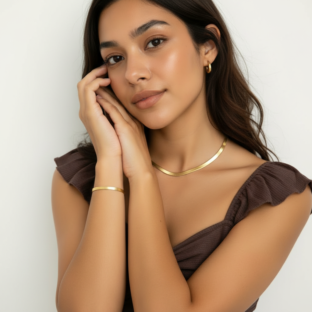 Woman wearing matching gold snake chain necklace and bracelet set – anti-tarnish everyday jewellery